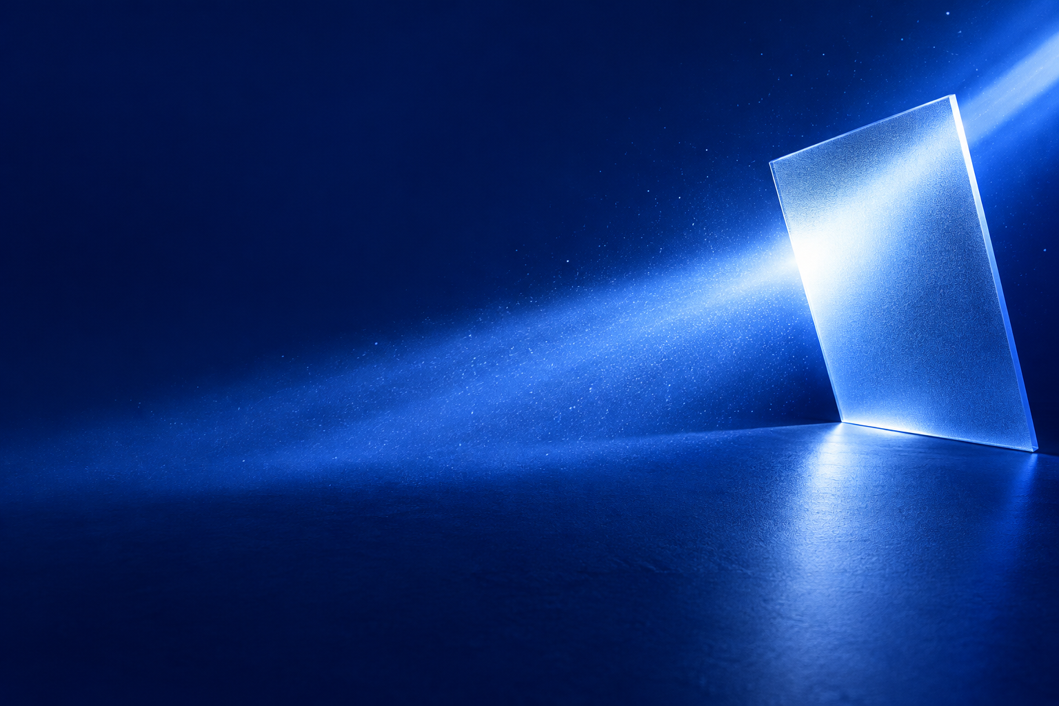 A beam of light thrown off a tilted pane of frosted glass across a deep blue ground, with the heliograph wordmark and the label Coming soon